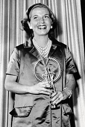 Jeanne holding one of the many awards she'd won